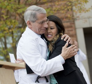 Dr. Anthony Fauci, director of the National Institute of Allergy and Infectious Diseases, hugs Patient Nina Pham Friday outside of National Institutes of Health (NIH) in Bethesda, Md.Associated Press
