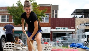 Cleveland, Ohio, junior Jolene Smith shovels rocks to build the ‘parklet,’ a seating area with table and benches, on Austin Avenue. Constance Atton I Lariat Photographer