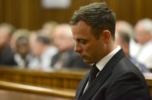 Oscar Pistorius sits in court in Pretoria, South Africa, Tuesday, Oct. 21, 2014 after judge Thokozile Masipais sentence Pistorius to five years imprisonment for culpable homicide in the killing of his girlfriend  Reeva Steenkamp last year.Associated Press