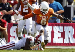 Texas Longhorns cornerback Quandre Diggs (6) stops Oklahoma Sooners wide receiver Jaz Reynolds (16) in the fourth quarter. The Texas Longhorns defeated the Oklahoma Sooners, 36-20, at the Cotton Bowl in Dallas, Texas, on Saturday, October 12, 2013.Tom Fox | Dallas Morning News