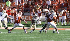 No. 32 sophomore running back Shock Linwood runs the ball Saturday afternoon against the Texas Longhorns.