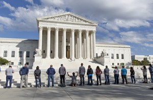 Pro-life advocates hold a prayer vigil Oct. 4 on the plaza of the high court in Washington. The group, Bound 4 Life, has come to the court for 10 years to make a silent appeal against abortion.Associated Press