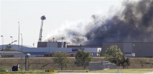 Firefighters try to put out a fire at Mid-Continent Airport in Wichita, Kan., Thursday shortly after a small plane crashed into the building killing several people including the pilot.Associated Press