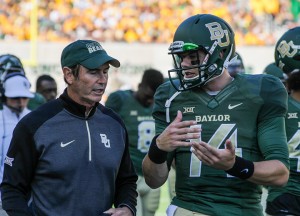 Head coach Art Briles and senior quarterback Bryce Petty discuss tactics on the sideline during Baylor’s 60-14 victory over Kansas on Nov. 1. Petty and the Bears are ranked No. 7 in the CFP committee rankings.Skye Duncan | Lariat Photographer