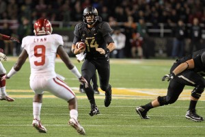 Senior quarterback Bryce Petty runs for a gain during Baylor’s 41-12 win over the Oklahoma Sooners on Nov. 7, 2013. The Bears will hold another Blackout game this Saturday.  Roundup File Photo