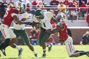 Sophomore wide receiver Corey Coleman keeps running in spite of efforts from the Sooners’ defense to hold him back Saturday in Norman, Okla. He set career highs with 15 catches and 224 yards.Kevin Freeman | Lariat Photographer