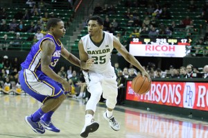 Freshman guard Al Freeman dribbles up the floor against a McNeese State defense during Baylor’s season-opening 80-39 win on Nov. 14. Skye Duncan | Lariat Photographer