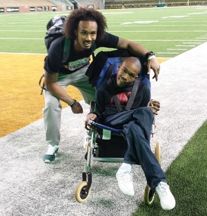 Senior receiver Levi Norwood meets with Midway High School student Jacoby Burks following the Bears’ win on Saturday. With its seven TDs, Baylor raised over $6,000 to support cerebral palsy research.Courtesy of Latricia Burks