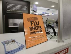 A sign lets customers know they can get a flu shot in a Walgreens store in Indianapolis. The flu vaccine may not be very effective this winter, according to U.S. health officials who worry this may lead to more serious illnesses and deaths. The Centers for Disease Control and Prevention issued an advisory to doctors about the situation this week. Associated Press