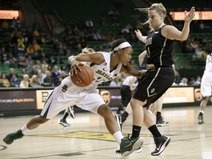 Baylor forward Nina Davis (13) fights off pressure from Idaho's Stacey Barr (10) as Davis attempts to move the ball up court during the first half of an NCAA college basketball game, Wednesday, Dec. 10, 2014, in Waco, Texas.Tony Gutierrez | Associated Press