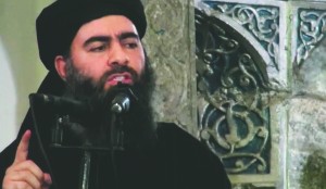 The leader of the Islamic State group, Abu Bakr al-Baghdadi, delivers a sermon July at a mosque in Iraq. Lebanese authorities have detained a wife and son of the leader of the Islamic State group and she is being questioned, Lebanese officials said Tuesday.Associated Press