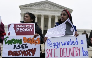 Vasu Reddy attends a rally to support Peggy Young on Wednesday outside the Supreme Court in Washington.Associated Press
