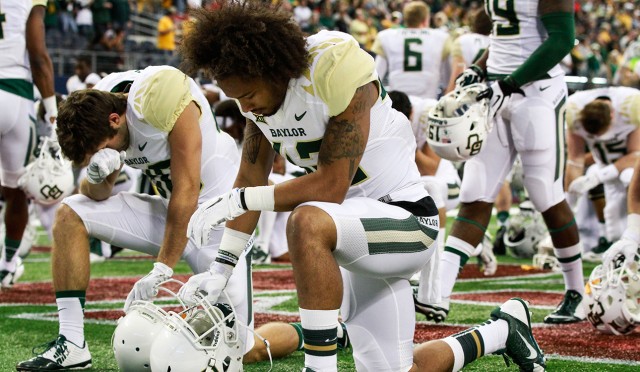 Faith and Football: BU players follow cross through victories, loss