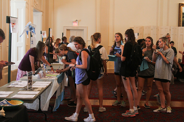 Students pick up information about study abroad programs in the Barfield Drawing Room of the Bill Daniel Student Center on Sept. 23, 2014.  Skye Duncan | Lariat Photographer