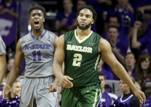 Kansas State's Nino Williams (11) celebrates as he walks across the court with Baylor's Rico Gathers (2) after a foul on Baylor during the second half of an NCAA college basketball game Saturday, Jan. 17, 2015, in Manhattan, Kan. Kansas State won 63-61.Charlie Riedel | Associated Press