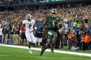 Sophomore receiver Corey Coleman runs down the field for a Baylor touchdown during the first half of the Bears' Cotton Bowl game against Michigan State. The Bears lead MSU 24-14 at the half.Skye Duncan | Lariat Photo Editor