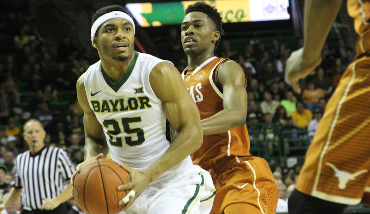 No. 11 redshirt freshman guard Al Freeman drives toward the basket against the University of Texas on Saturday at the Ferrell Center. The Bears dominated the Longhorns in a 83-60 victory.Kevin Freeman | Lariat Photographer