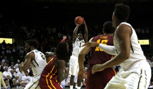 No. 1 senior guard Kenny Chery releases the ball to score a jumper that gave the Bears their one point lead that they needed to beat the Iowa State Cyclones 74-73 with four seconds remaining. Chery ended the night with 13 points against the Cyclones.Kevin Freeman | Lariat Photographer