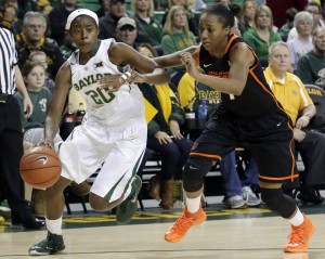 Baylor guard Imani Wright (20) drives against Oklahoma State guard Brittany Atkins (1) during the first half of an NCAA college basketball game on Saturday. The Lady Bears won 61-45.LM Otero | Associated Press