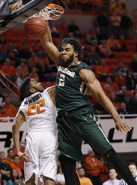 Baylor forward Rico Gathers (2) dunks over Oklahoma State forward Jeff Newberry (22) during the second half of an NCAA college basketball game in Stillwater, Okla., Tuesday, Jan. 27, 2015. Oklahoma State won 64-53. (AP Photo/Sue Ogrocki)