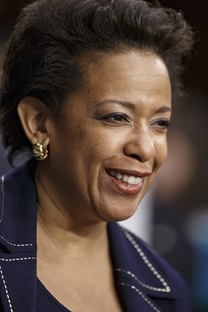 Attorney general nominee Loretta Lynch smiles on Capitol Hill in Washington, Wednesday, Jan. 28, 2015, as she is introduced before the Senate Judiciary Committee for her confirmation hearing. If confirmed, Lynch would replace Attorney General Eric Holder, who announced his resignation in September after leading the Justice Department for six years. She is now the U.S. Attorney for the Eastern District of New York. This is the first nomination hearing under the new Republican majority.  (AP Photo/J. Scott Applewhite)