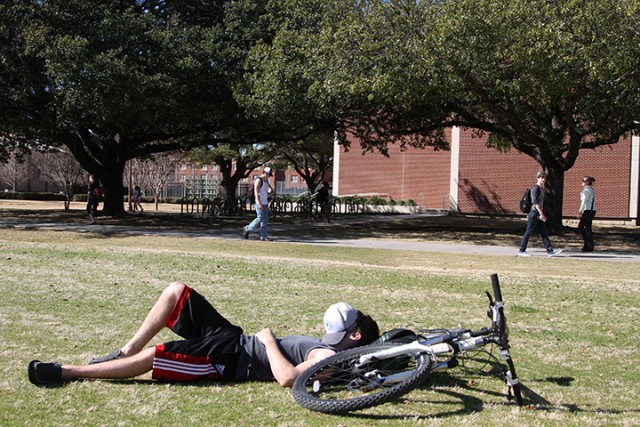 Lumberton junior Rafe Simmons enjoying the nice sunny weather by taking a nap in between classes on Fountain Mall.