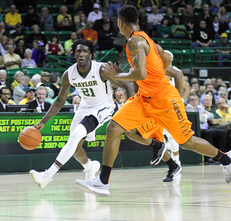Junior forward Taurean Prince drives down the court during No. 16 Baylor's 74-65 loss to No. 21 Oklahoma State on Monday. Prince led the way with 20 points.Skye Duncan | Lariat Photo Editor