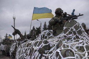 Ukrainian military vehicles drive towards Debaltseve on the outskirts of Artemivsk, eastern Ukraine, Sunday, Feb. 8, 2015. The government-held town of Debaltseve, a key railway junction, has been the epicenter of recent battles between Russian-backed separatists and Ukrainian government troops.  Associated Press