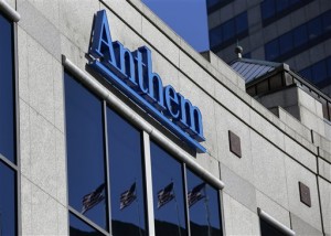 In this Feb. 5, 2015 file photo, the Anthem logo hangs at the health insurer's corporate headquarters in Indianapolis. Insurers aren't required to encrypt consumers' data under a 1990s federal law that remains the foundation for health care privacy in the Internet age _ a striking omission in light of the cyberattack against Anthem, the nation's second-largest health insurer. (AP Photo/Michael Conroy)
