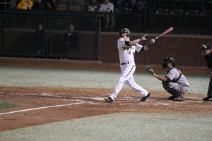 Sophomore designated hitter Darryn Sheppard swings the bat during Baylor's season-opening win over No. 13 Cal Poly. Sheppard accumulated four hits and scored four runs during the Bears' season-opening sweep. Jess Schurz | Lariat Photographer