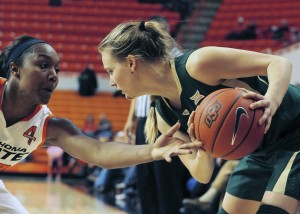 Oklahoma State guard Roshunda Johnson, left, reaches for the basketball held by Baylor guard Kristy Wallace during the first half of Baylor's game on Wednesday. Wallace had 5 points in the 69-52 Baylor win over Oklahoma State.Associated Press