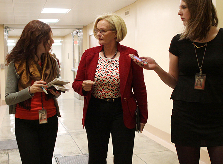 Sen. Claire McCaskill, D-Mo., center talks to reporters Wednesday on Capitol Hill in Washington, as Senate Democrats and Republicans headed to their party caucus meetings to discuss the homeland security funding.  Associated Press