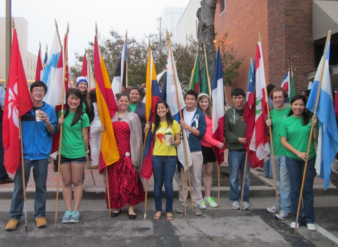 Members of the Global Community LLC carry the flags they walked with in the Homecoming Parade Saturday, Nov. 1, 2014. Photo Courtesy of the Global LLC