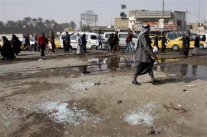 Broken glass remains at the scene of a suicide bomb attack at Adan Square, located in a predominantly Shiite part of the capital, Baghdad, Iraq, Monday, Feb. 9, 2015.  President Barack Obama is expected, as early as Tuesday, to ask Congress for new war powers, sending Capitol Hill his blueprint for an updated authorization for the use of military force to fight the Islamic State group. Haggling then begins on writing a new authorization to battle the Sunni extremists, who have seized territory in Iraq and neighboring Syria and imposed a violent form of Sharia law. (AP Photo)