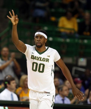 Baylor forward Royce O'Neale (00) reacts to his three-point shot over Kansas State in the first half of an NCAA college basketball game, Saturday, Feb. 21, 2015, in Waco, Texas. Associated Press