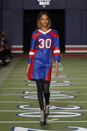 A model walks the football field-inspired runway wearing a look from Tommy Hilfiger's fall 2015 collection on Monday, Feb. 16, 2015, at the Park Avenue Armory on Manhattan's East Side. The fashion show, part of Mercedes-Benz Fashion Week, marked Hilfiger's 30th anniversary. Courtesy Art