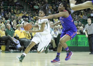 Junior point guard Niya Johnson drives past a Kansas defender during Baylor's 66-58 win over Kansas on Sunday. Johnson finished with 13 points and 10 assists in the win.Skye Duncan | Lariat Photographer