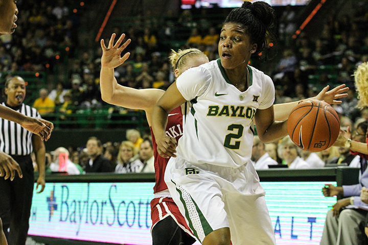 No. 2 junior guard Niya Johnson breaks past an OU defender. Johnson posted 17 assists and zero turnovers as the Baylor coasted past the Sooners to a sound 89-66 defeat.Kevin Freeman | Lariat Photographer