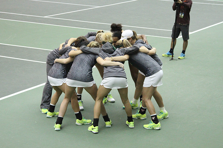 Baylor women's tennis huddles up before its win over No. 5 Virginia on Jan. 24. The Lady Bears feature four international players on their diverse rosterHannah Haseloff | Lariat Photographer