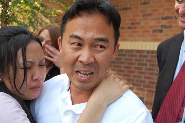 In this Aug. 5, 2010 photo, Koua Fong Lee embraces his wife, Panghoua Moua, in St. Paul, Minn., after learning charges against him were dropped. Lee spent 2 1/2 years in prison for criminal vehicular homocide before being released after reports suggested some Toyota cars had problems. Associated Press