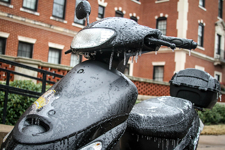 A moped is left iced-over after wintery weather and below-freezing temperatures slapped Waco Monday and Tuesday. The Winter Storm Quantum swept across most of the southern U.S. and is predicted to continue bringing winter weather to the South throughout the week.  Jess Schurz | Lariat Photographer