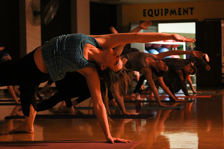Austin senior Meredith McCarty participates in a Bearobics yoga class led by Brittainy Tidwell Wednesday in the Student Life Center. Various new courses for student’s health and well-being were recently added in the SLC.  Kevin Freeman | Lariat Photographer