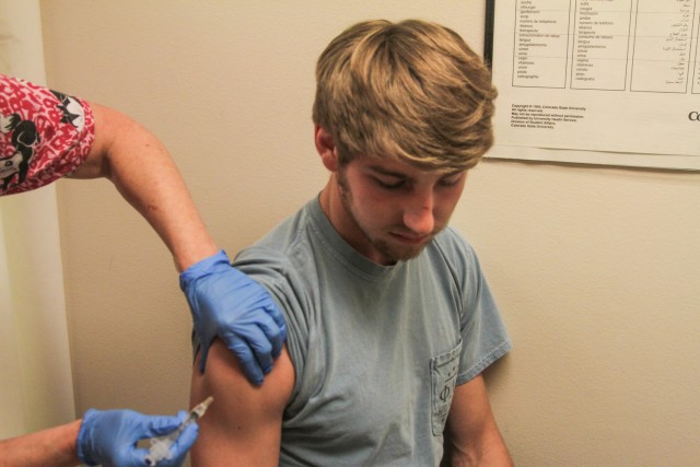 Bridgeport sophomore Mark Garrison receives a vaccination Wednesday afternoon in the Baylor University Health Center in the Student Life Center. The health center provides flu shots, allergy shots, meningitis vaccinations and measles-mumps-rubella (MMR) vaccinations.  Skye Duncan | Lariat Photo Editor