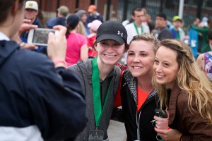 Several proud finishers smile for a photo after their half marathon this Saturday at McLane stadium. The rainy weather did not stop Baylor's anual Bearathon from taking place this weekend, put on by Student Foundation.  Jess Schurz | Lariat Photographer