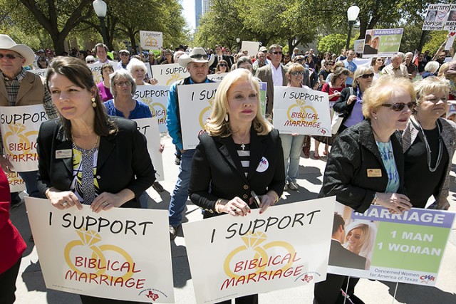 Cindy Asmussen, Jan Jones and Mary Smith hold signs as they oppose gay marriage during a Defense of the Texas Marriage Amendment Rally on Monday outside the state Capitol in Austin. The rally supported what they call “biblical marriage,” a union between a man and a woman.  Associated Press