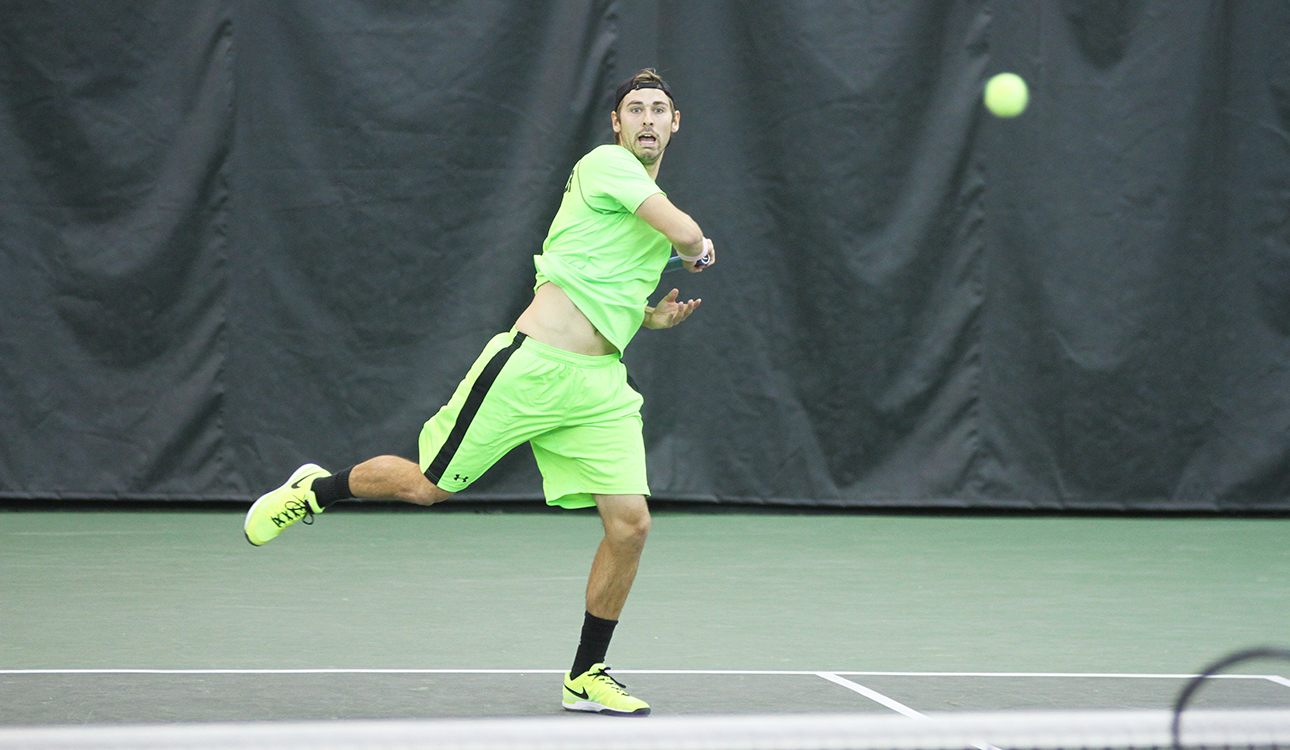 No. 11-ranked junior Julian Lenz returns the ball against No. 11 Virginia on Sunday afternoon at the Hawkins Indoor Tennis Center. Baylor won the match 5-2. Skye Duncan | Lariat Photo Editor