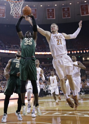 Baylor’s Johnathan Motley (35) tries to shoot as Texas’ Connor Lammert (21) defends during the first half of an NCAA college basketball game on Monday in Austin. Associated Press