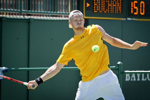 Sophomore Vince Schneider prepares to hit a forehand during the second-ranked Baylor Bears’ 7-0 sweep over Incarnate Word on Sunday afternoon.  Jess Schurz | Lariat Photographer
