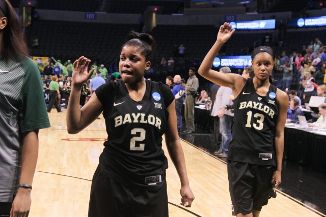 Sophomore forward Nina Davis and junior guard Niya Johnson do a sic 'em after the Lady Bears lost 77-68 in the Elite Eight in Oklahoma City. Skye Duncan | Lariat Photo Editor