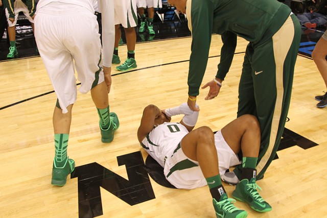 Former All-American point guard Odyssey Sims rolls on the floor after the No. 1 Baylor Lady Bears were upset by Louisville in the Sweet 16 round of the NCAA Tournament on March 31, 2013. The Lady Bears will play again in the Sweet 16 on Friday at Chesapeake Arena in Oklahoma City.   Lariat File Art